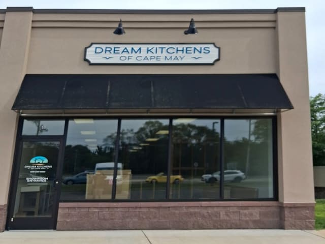 Dream Kitchens of Cape May storefront with its sign above a black awning