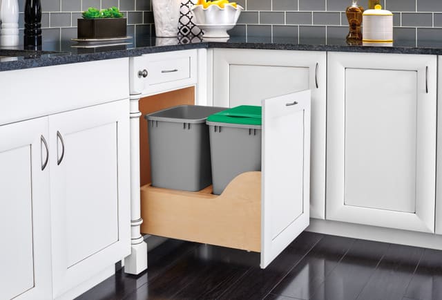 Double trash pull-out in a white base cabinet